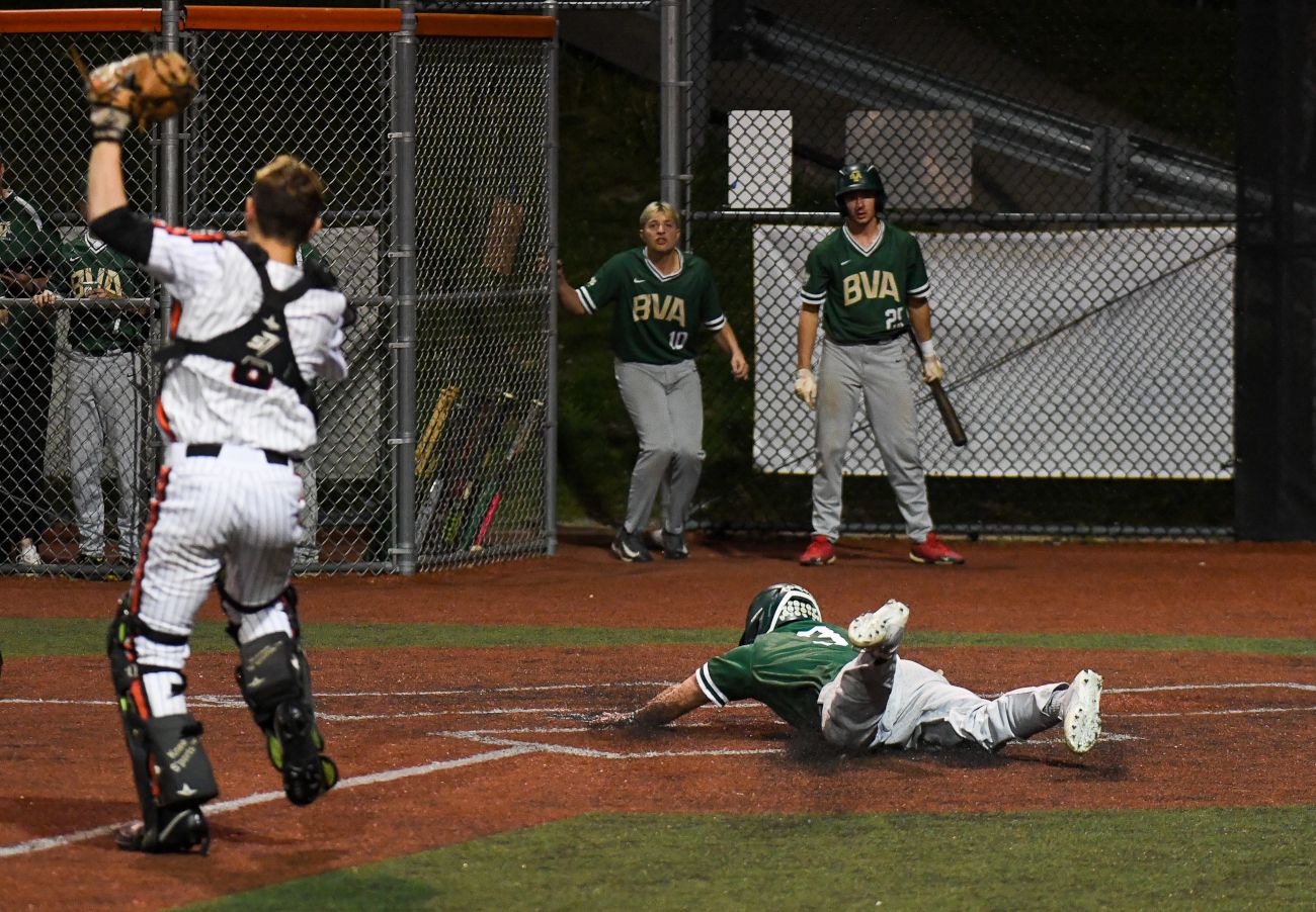 Adam LaCarte scores the game-winning run in the top of the 12th inning to lift Belle Vernon to a 4-3 win over Greater Latrobe. (Photo by www.westernpasports.com)