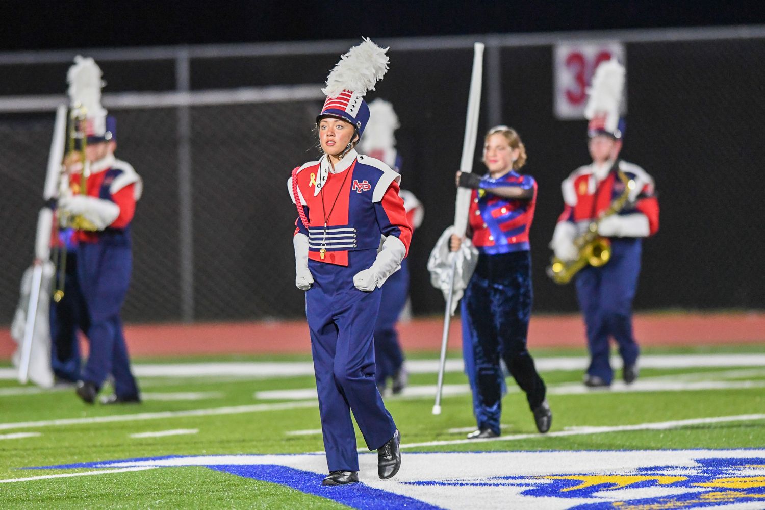 The Mount Pleasant Area marching band performs at halftime. (Photo by www.westernpasports.com)