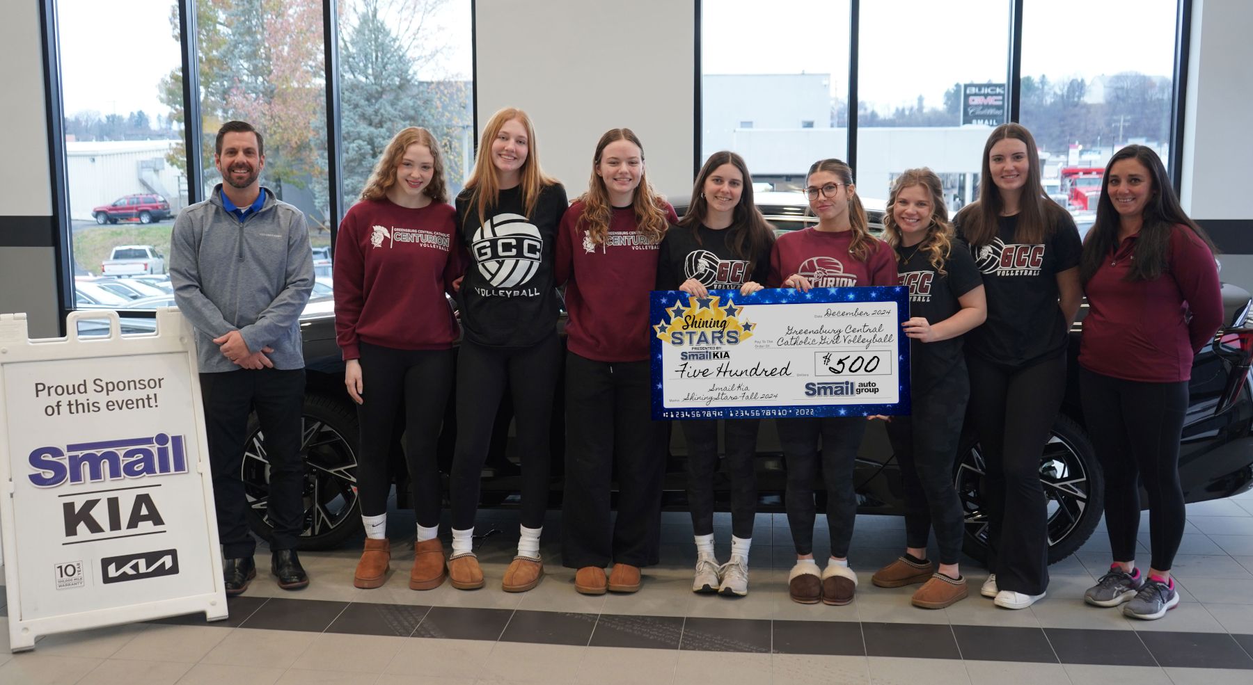 Pictured From L-R: Jeff Mikell (Smail Kia), Erin Grace, Ashlyn Black, Maura Oslosky, Abby Dei, Eva Denis, Brianna Evans, Evelyn Viehl, Coach Erin Salas