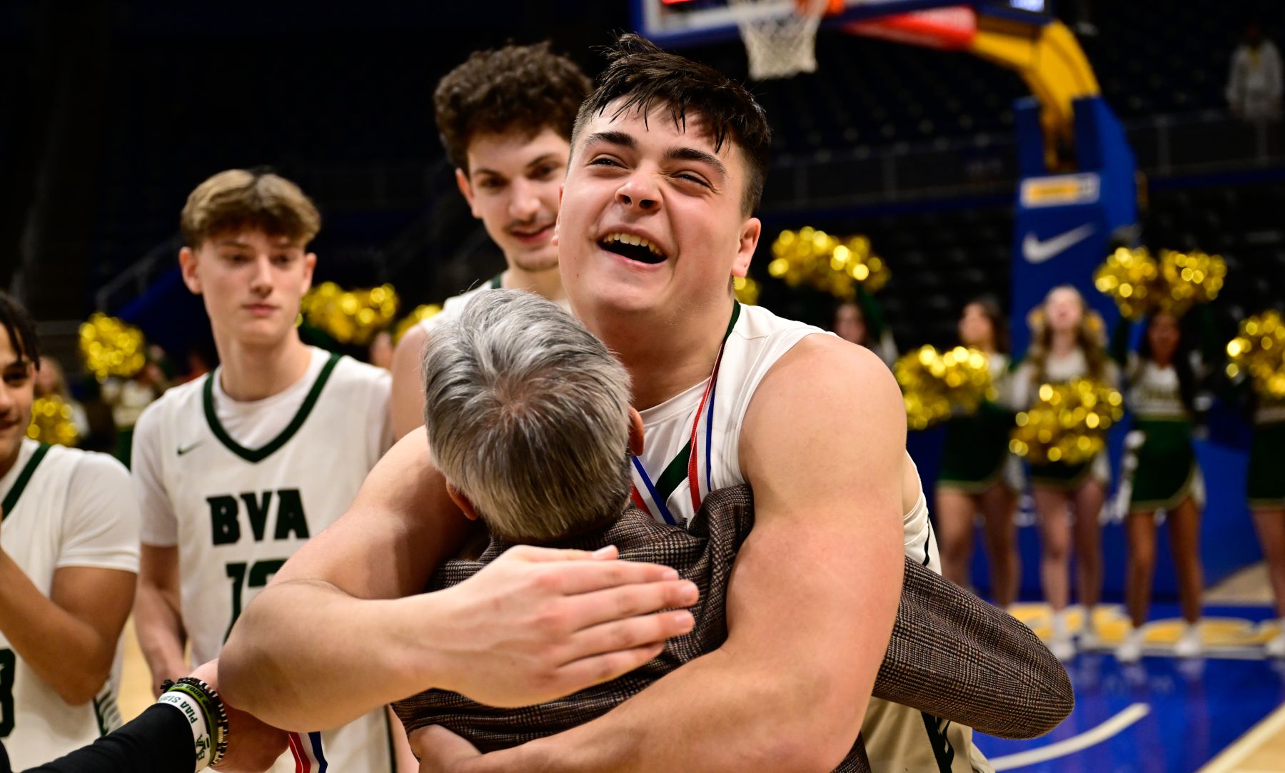 Belle Vernon's Dom Ghilani celebrates with coach Joe Salvino after the Leopards claimed the WPIAL title. (Photo by Ed Thompson)