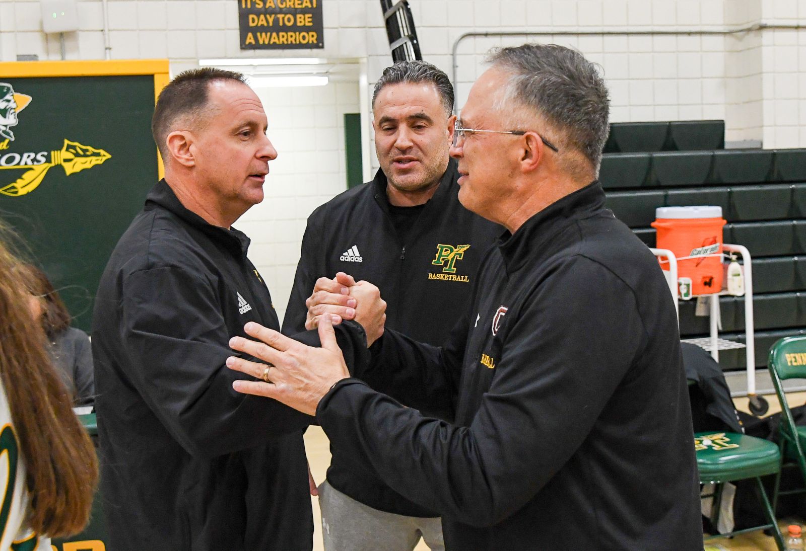 Coach Chuck Fontana (left) shakes hands with Greensburg Salem girls coach Rick Klimchock following a game last season. (Photo by www.westernpasports.com)