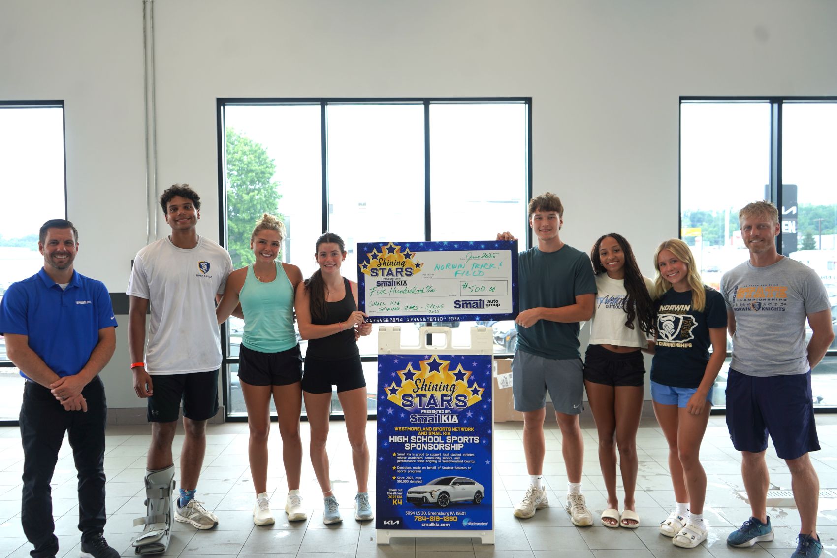 Pictured From L-R: Jeff Mikell (Smail Kia), Jeremiah Francis, Karina Karadus, Myla McCabe, Sauly Guyaux, Mel Schmidt, Annie Czajkowski, Coach Tim Van Horn.