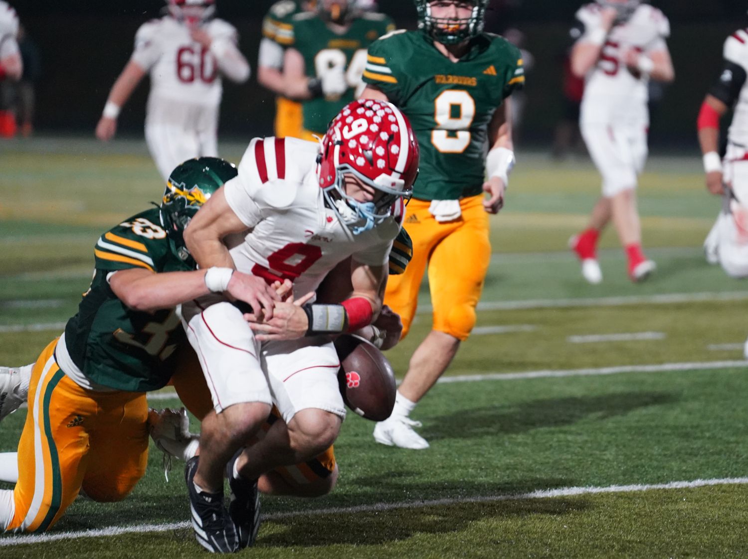 Moon quarterback Andrew Cross appears to fumble but officials ruled Cross down and the Tigers went on to score the game-winning touchdown Friday night against Penn-Trafford in a WPIAL 5A quarterfinal game.