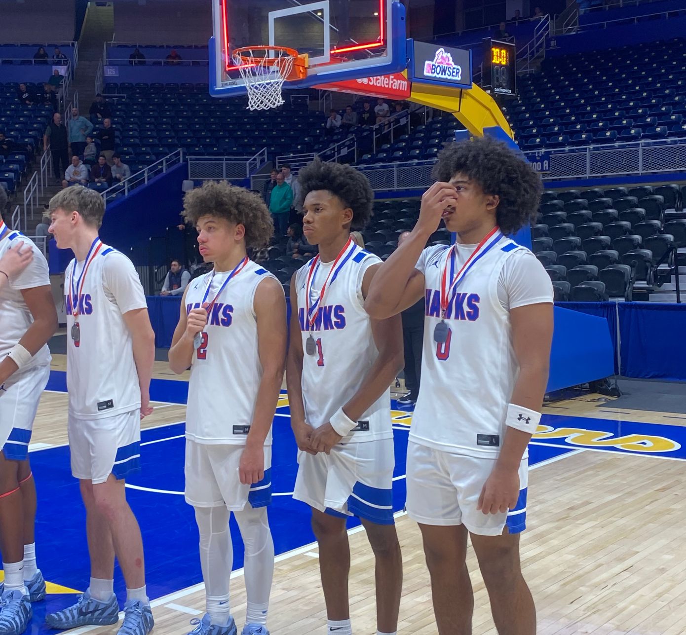 Noah Clary, Jayce Powell, Kymon'e Brown and Xavier Odorisio-Farrow stand with their silver medals following the WPIAL 2A Championship game at the Petersen Events Center.