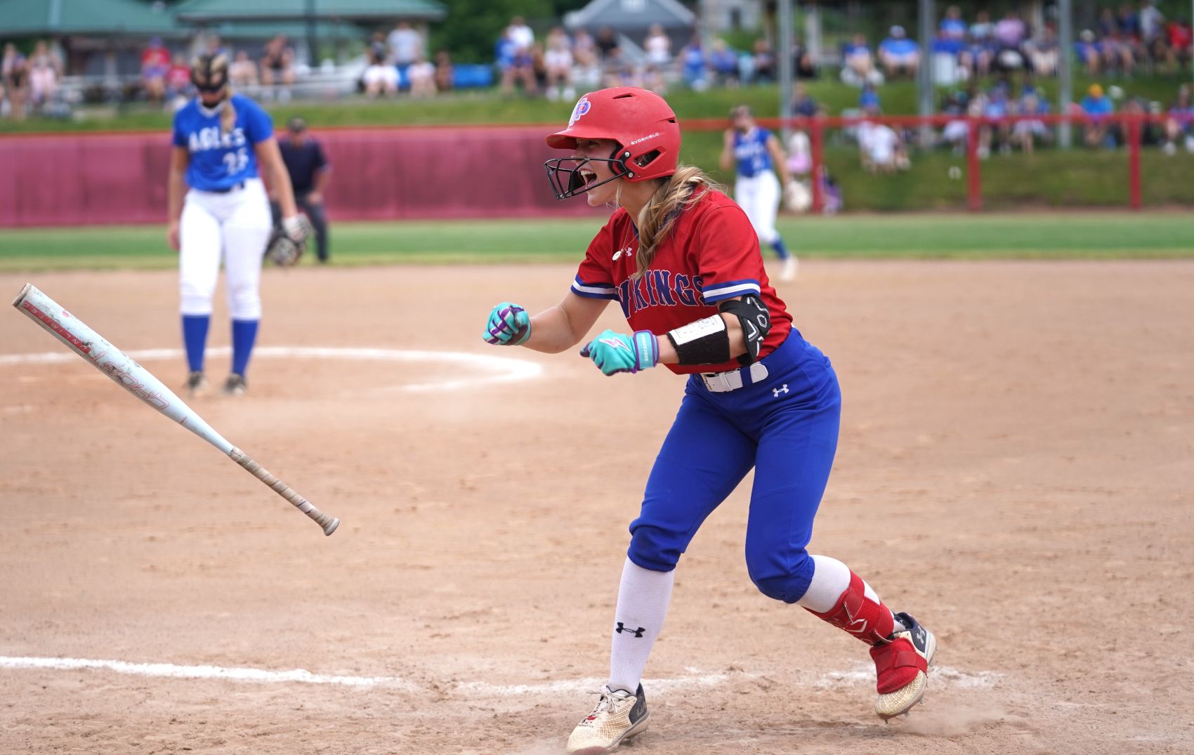 Mount Pleasant's Sadie Poole celebrates after being hit by a pitch in the third inning. She would score on a single by Jenna Whipkey. (Photo by Dan Flickinger)