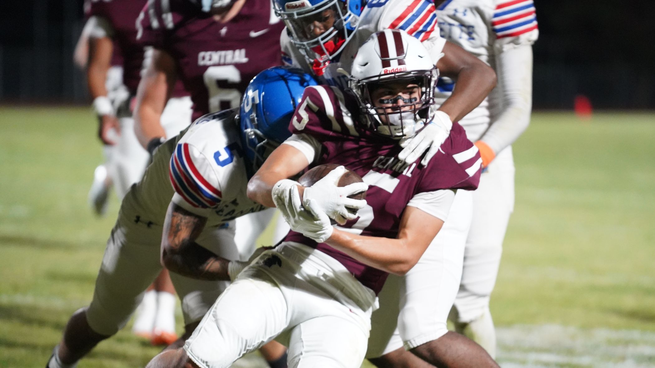 Greensburg Central Catholic's Lucca Denis is tackled by Jeannette's Trevor Tillman and Damiere Scarborough. (Photo by Sean Delaney)