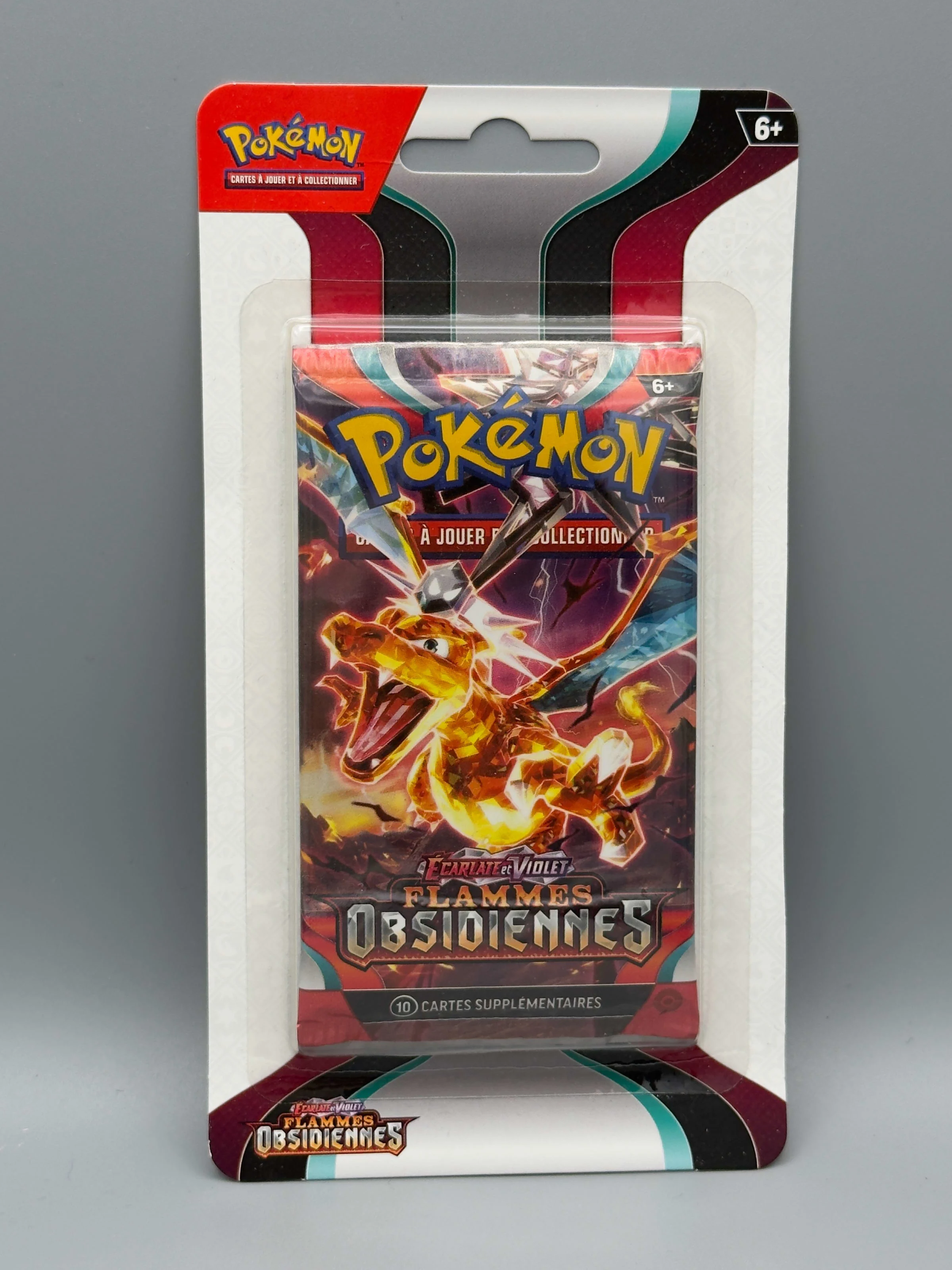 Booster blister Flammes Obsidiennes, illustration Dracaufeu
