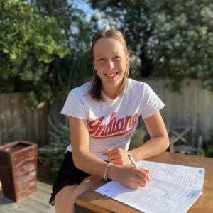 Niamh Monk signs on the dotted line cementing a four-year rowing scholarship at Indiana University. Photo / Supplied.