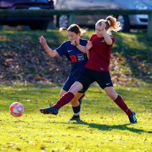 Eva Thompson, left, had a strong match until suffering a head knock late in the second half.