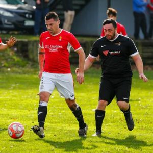 Athletic Reserves' Anthony Floyd looks for an opening, covered by City's Kyle Graham Luke. Photo / Lewis Gardner.