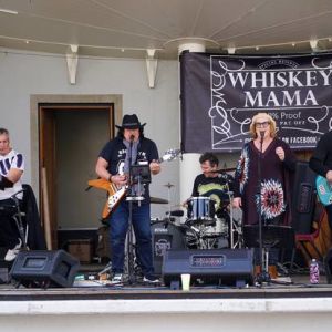 Local rock band Whiskey Mama performed a free concert for the crowd. Photo / Lewis Gardner.