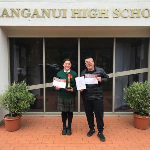 Reina and Chinese teacher, Mr Ding, with their awards!