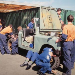 Whanganui High School students work on the Land Rover. Photo / Bevan Conley.