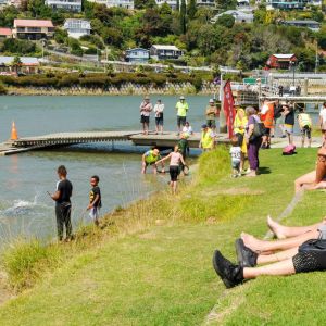 Spectators took to the banks of the Whanganui River to watch swimmers competing in the Bridge to Bridge swim. Photo / Lewis Gardner.