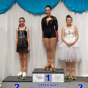 Pippa on the podium receiving her Silver Medal in Cadet Solo Dance combined event with Freedance.