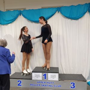 Pippa on the podium receiving her other Silver Medal in Cadet Figures.