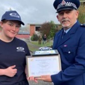 Whanganui student Cyprus Lily Hill received her award from reviewing officer Inspector Senior Constable Kevin Raynes at the event in Taupo.  Photo / supplied.(Whanganui Chronicle, Photo supplied)