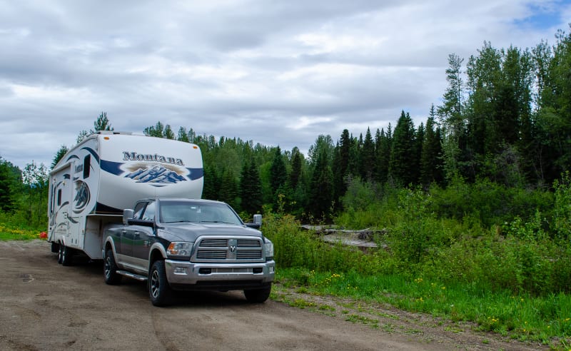 our rv parked along a river in a highway rest area