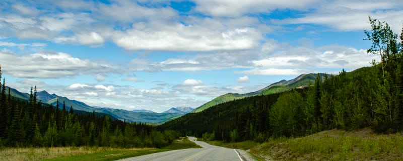 Road descending into a wide valley