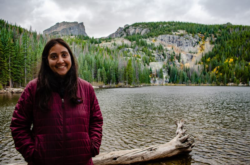 sushila standing in front of a lake