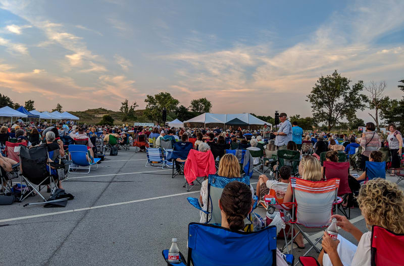 view of the concert crowd with dunes in the background