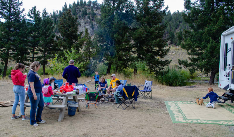 family gathered for a campfire cookout