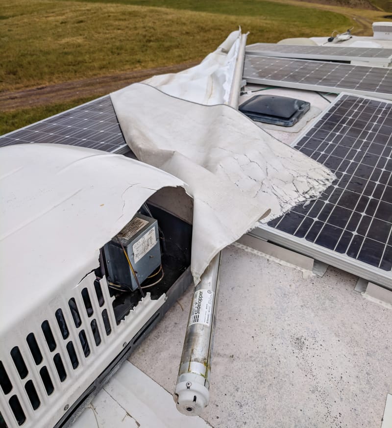 slide topper laying across the roof of the rv