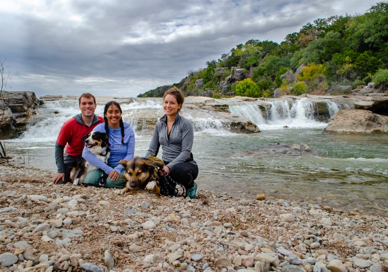 posing with our friend cassie in front of a waterfall