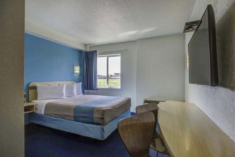 Simple, clean, and comfortable—our queen-bed room is designed for a great night’s sleep.