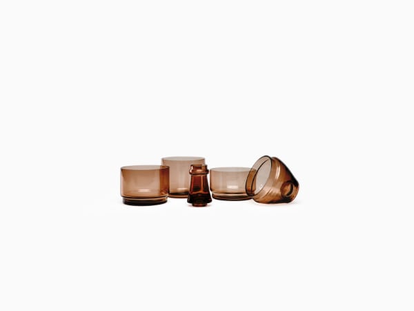 L'apéro. Stackable Bowls. Vintage style apperitive set composed of four tinted glass bowls and a toothpick holder. It forms a wine bottle once stacked, transforming into a piece of decoration for your home.