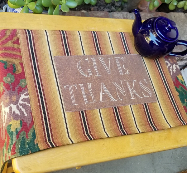 Show your gratitude on your table (or dresser, cabinet, piano, bookcase, etc.) with this lovely embroidered “Give Thanks” runner, whether it’s on Thanksgiving, or all year long.
These rich, earth tone  colored FabMo home decor fabrics were rescued from the landfill, and given new life. Click on my Etsy shop link for more details on this locally made piece.
FREE shipping, or arrange to pickup in Cupertino! 