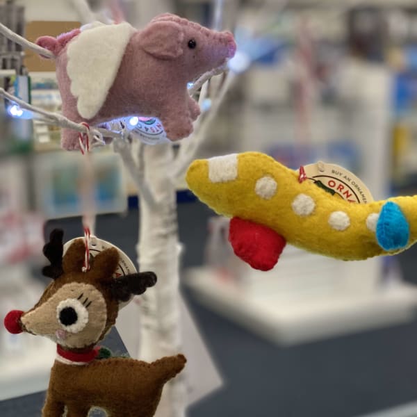 What does a pig with wings, an airplane, and a reindeer have in common?  They all can fly!  Yes Pigs Can Fly at the Hiller Aviation Museum!  Get these beautiful handmade felt ornaments for $12.99 each.  Investments are made back into the communities to provide jobs, prevent orphans and keep vulnerable children with their families.