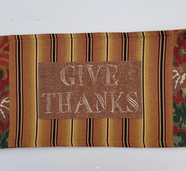 Show your gratitude on your table (or dresser, cabinet, piano, bookcase, etc.) with this lovely embroidered “Give Thanks” runner, whether it’s on Thanksgiving, or all year long.
These rich, earth tone  colored FabMo home decor fabrics were rescued from the landfill, and given new life. Click on my Etsy shop link for more details on this locally made piece.
FREE shipping, or arrange to pickup in Cupertino! 