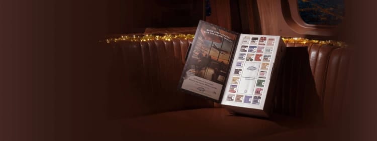 A luxurious whiskey advent calendar with various small bottles of whiskey nestled behind numbered doors.