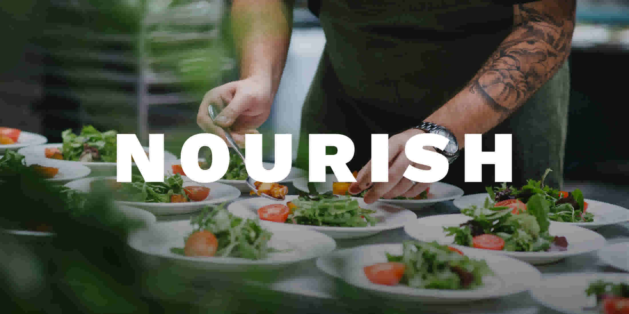 Hands of a chef preparing multiple dishes of food for a food event at Nourish Whistler Wellness Series