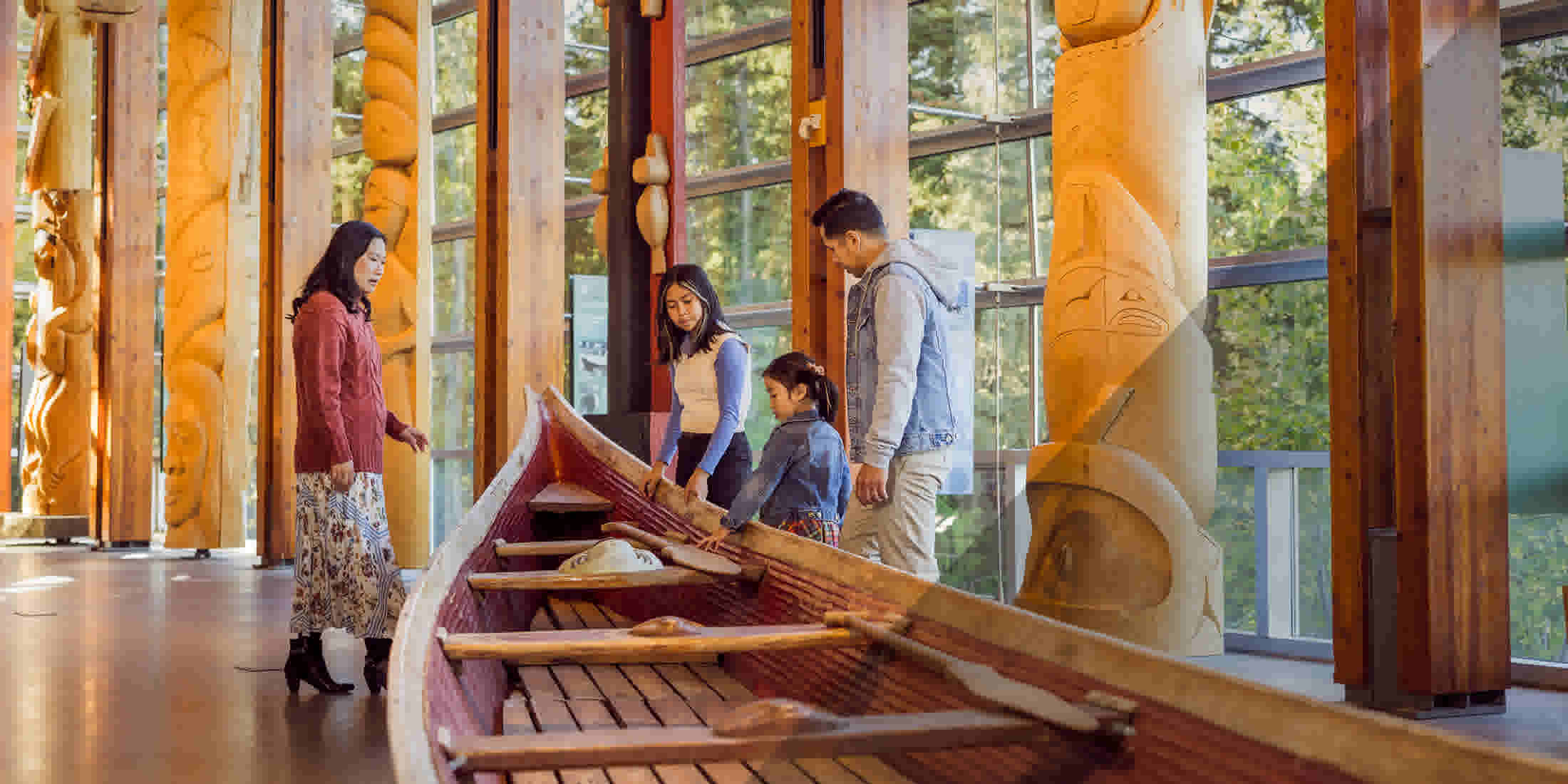 A family enjoying Indigenous art in Whistler BC