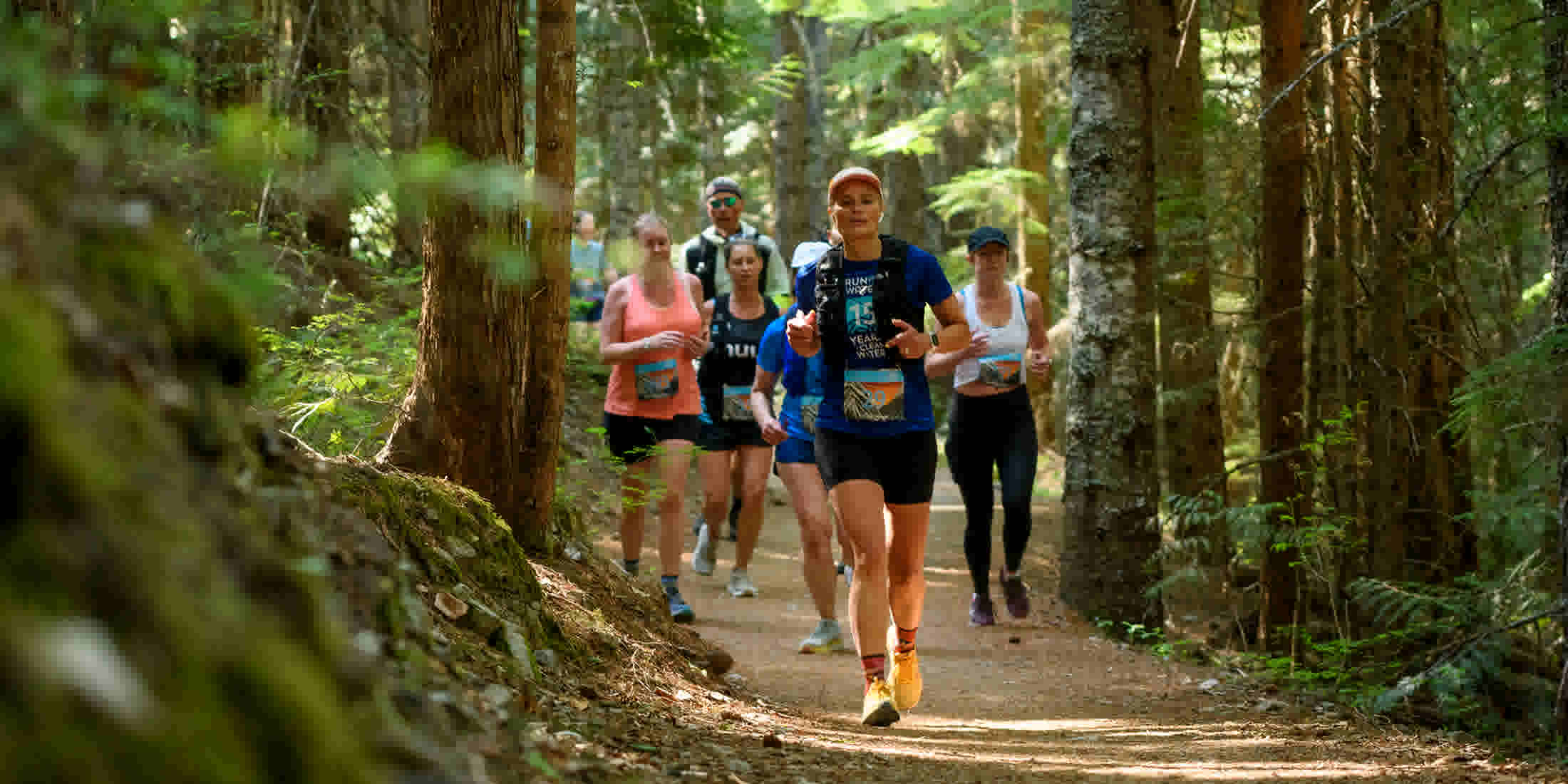 Runners in the forest during Whistler Half Marathon