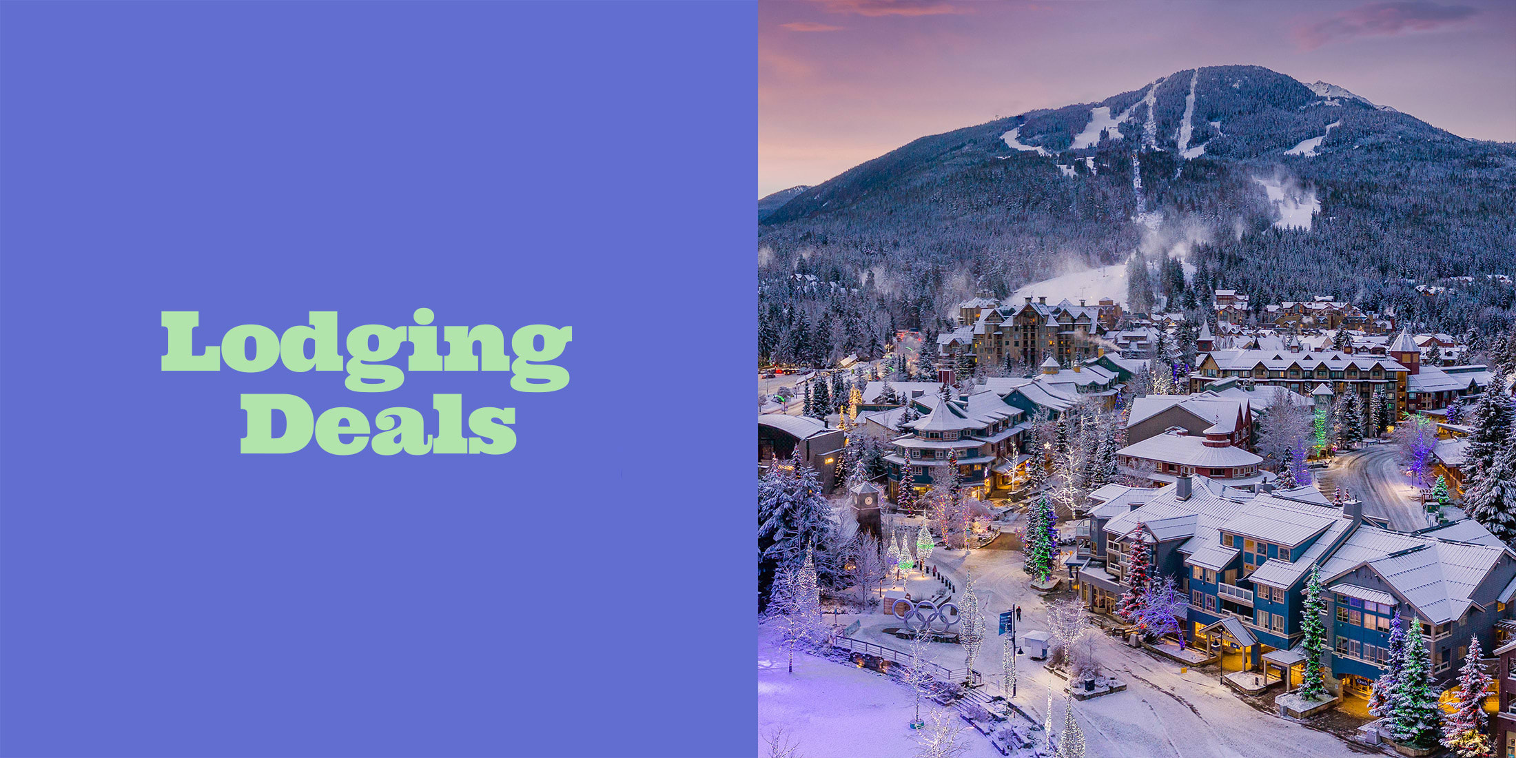 View of snow covered rooftops, mountains and Whistler Village on a winter day
