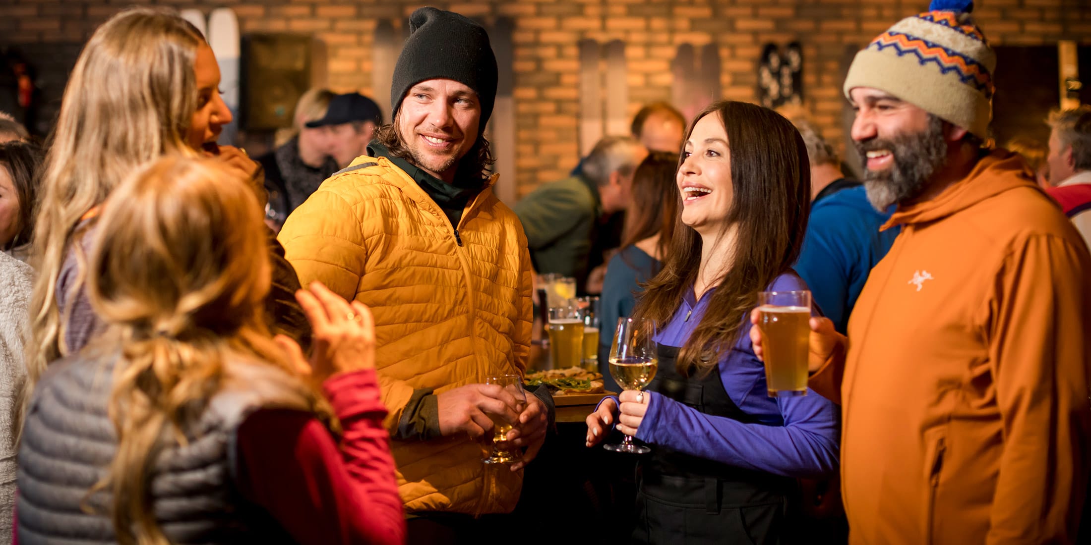 People enjoying après in the winter at RMU Whistler in the Upper Village