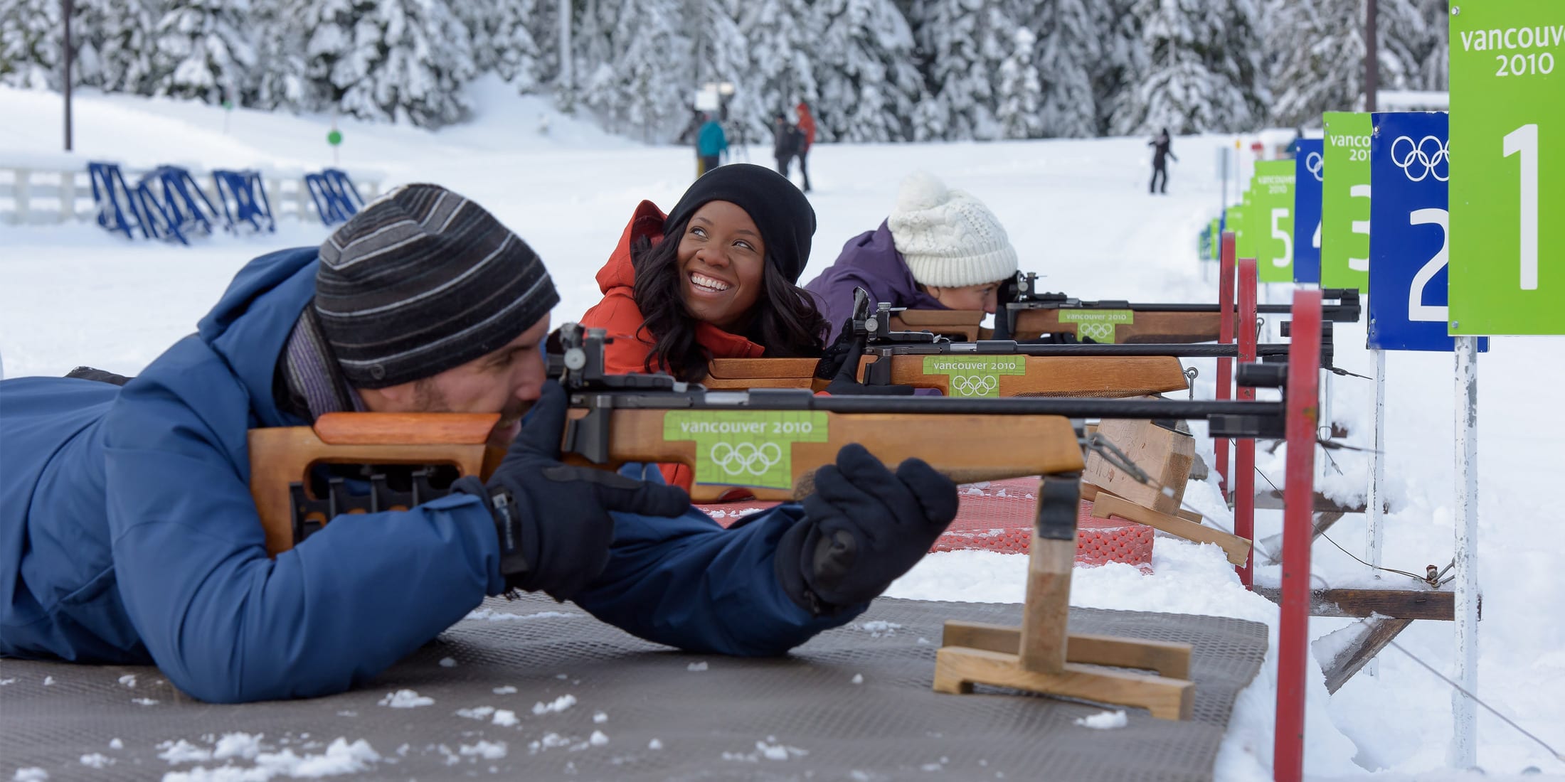 Guests take part in a winter biathlon experience at Whistler Olympic Park, aiming .22 calibre rifles at the official Olympic shooting range during a guided activity in Whistler, British Columbia.
