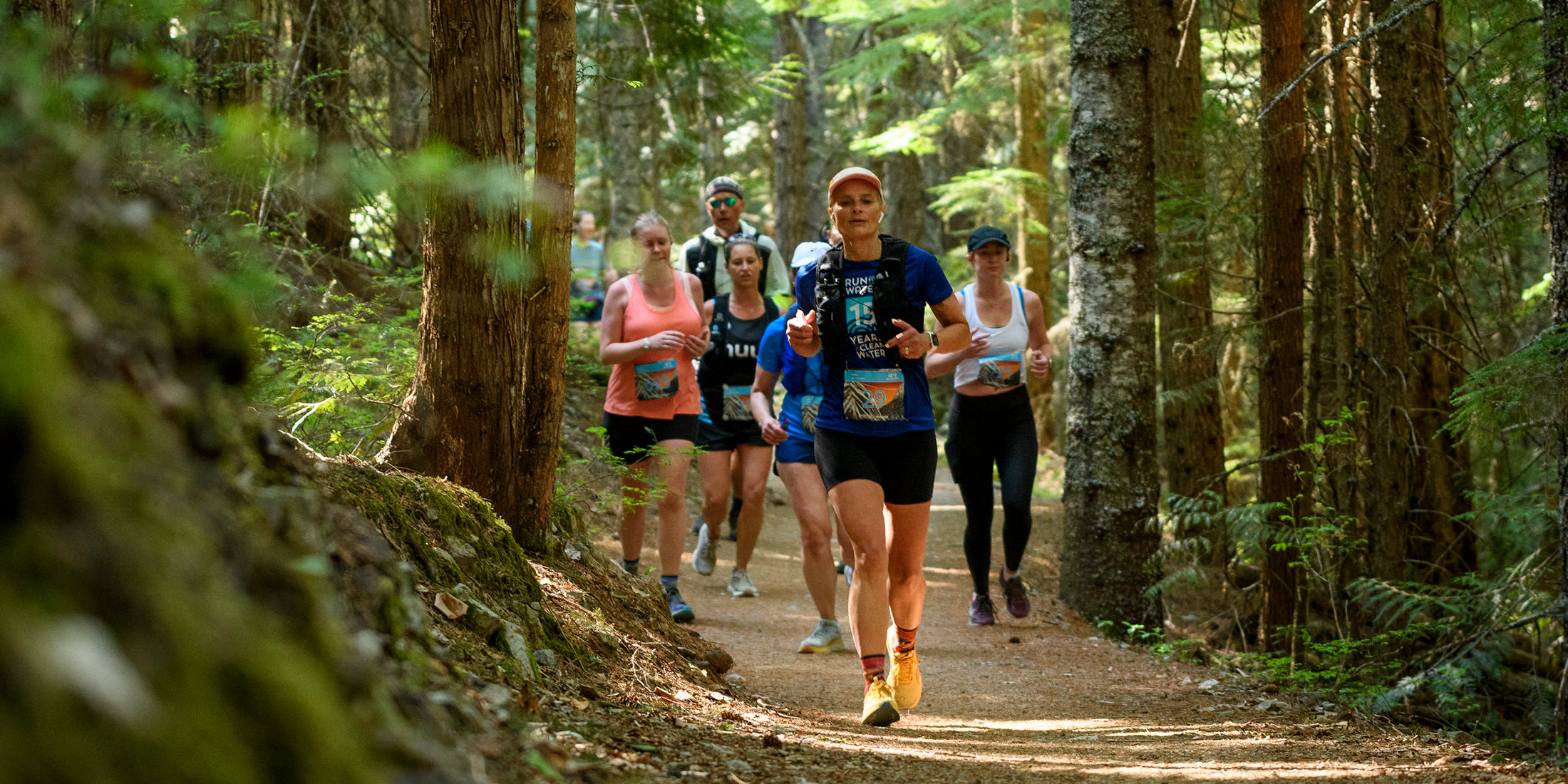 Runners in the forest during the Blueshore Whistler Half Marathon