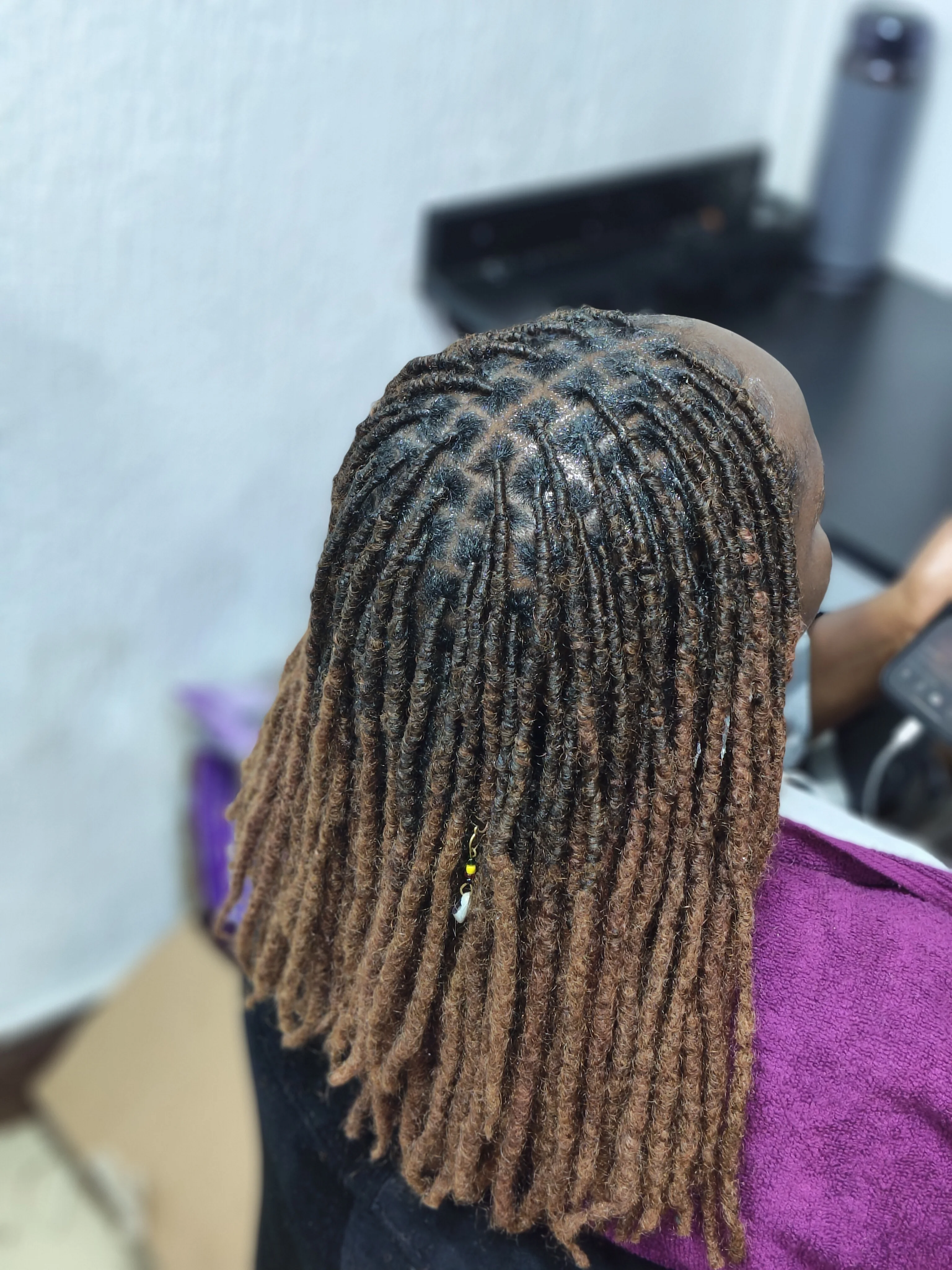 Sister locs installation at Fabz Hair Nairobi