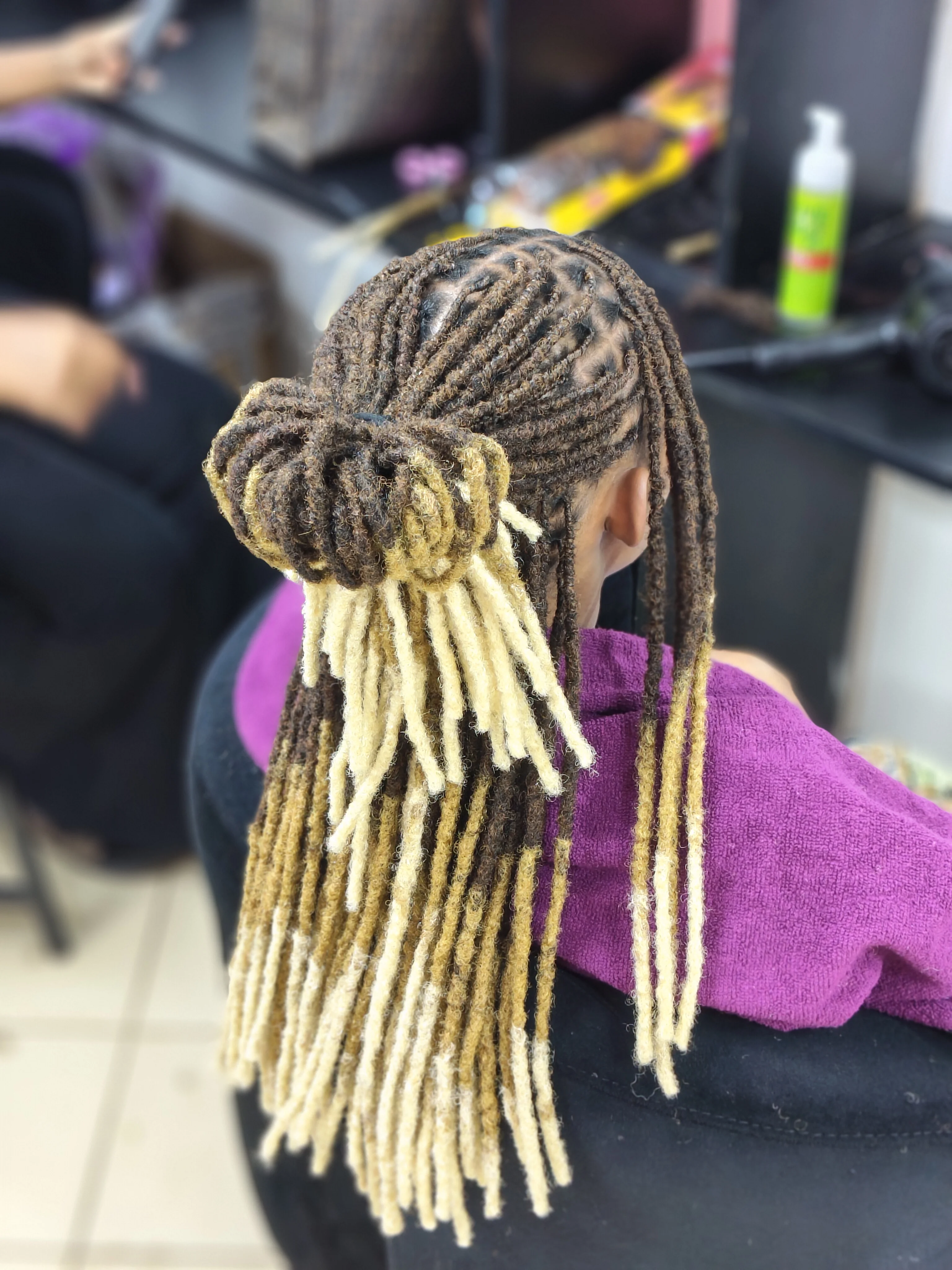 Close-up of perfectly styled locs by Fabz Hair