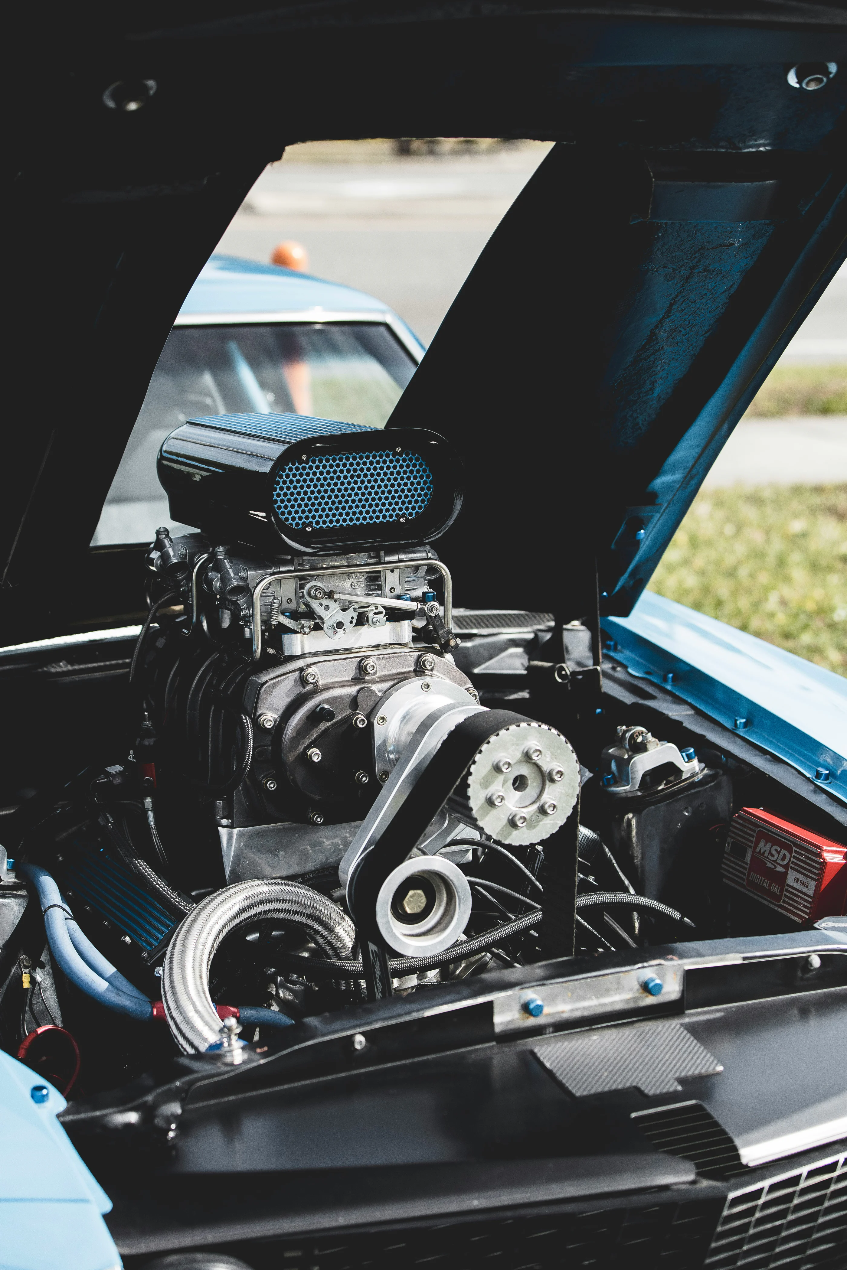 A close up of a powerful car engine with supercharger