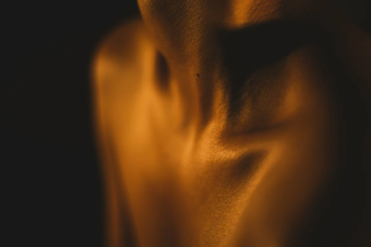 A blurry photo of a persons torso
