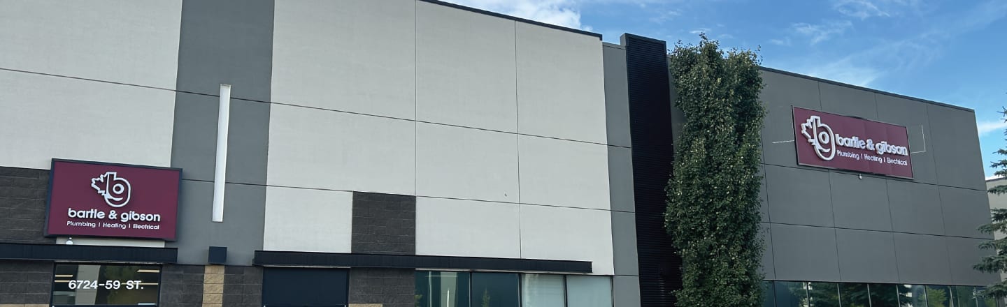 Exterior view of the Edmonton South location for Bartle & Gibson, showcasing the storefront and large signage.