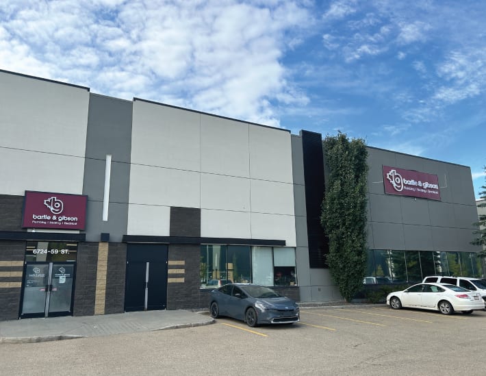 Exterior view of the Edmonton South location for Bartle & Gibson, showcasing the storefront and large signage.