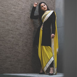 Make it Classy wearing a long black jacket over a bright yellow saree Make it Classy wearing a long black jacket over a bright yellow saree