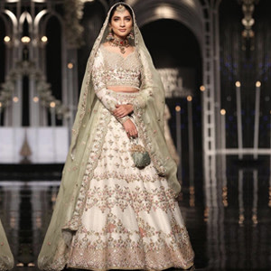 White Bridal Lehnga Paired with a Colored Dupatta White Bridal Lehnga Paired with a Colored Dupatta