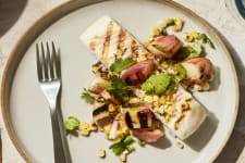 grilled pacific halibut fillet with peach and corn salsa recipe on a plate